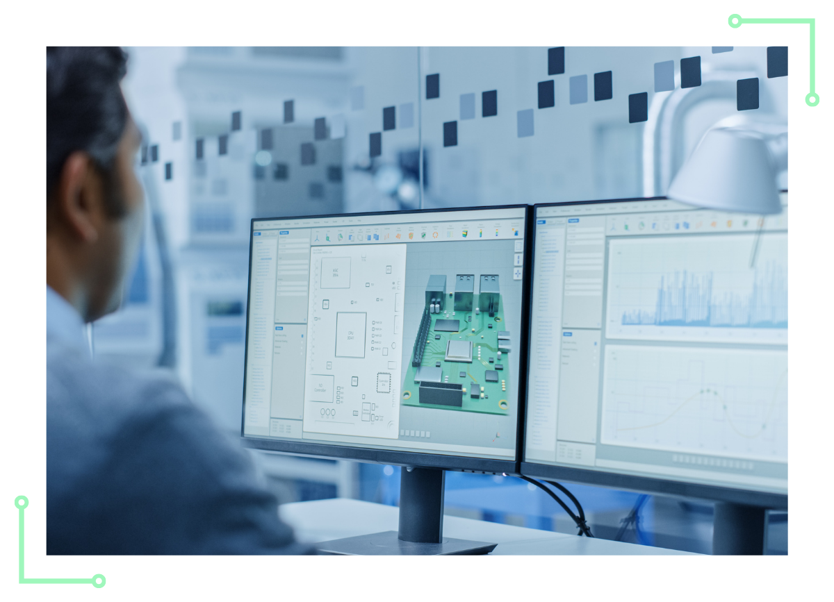 An eletronic engineer reviews a custom pcb design on two computer monitors before electronic product manufacturing can begin.